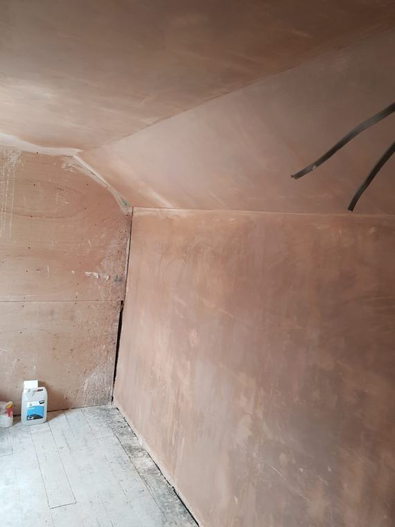 Fresh plaster on sloped ceiling and wall