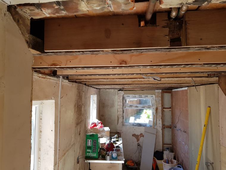 Room refurbishment showing ceiling repair and exposed timbers