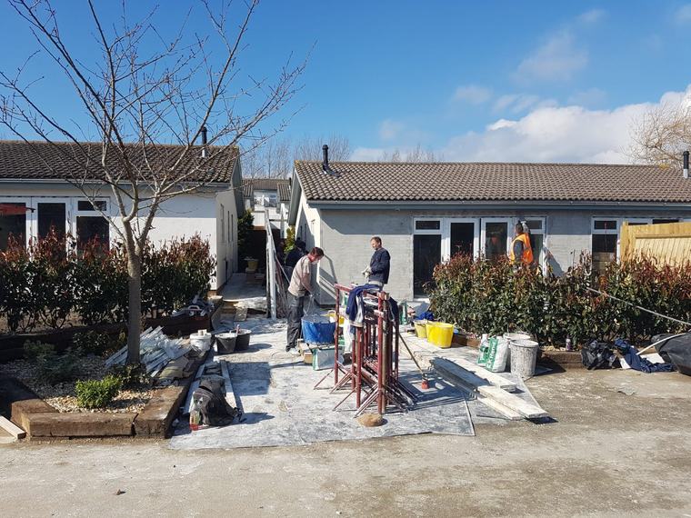 Building team working on exterior refurbishment