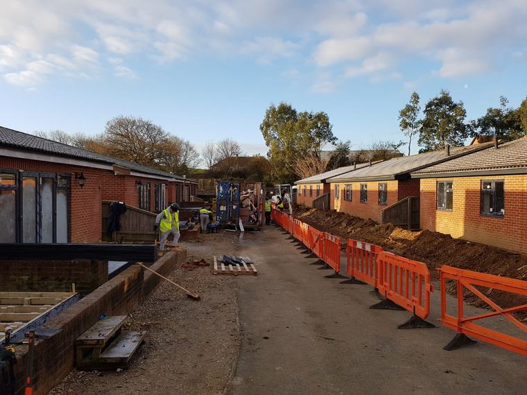 Residential site with groundworks and construction team