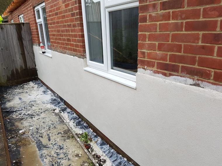 External wall with render base and brickwork