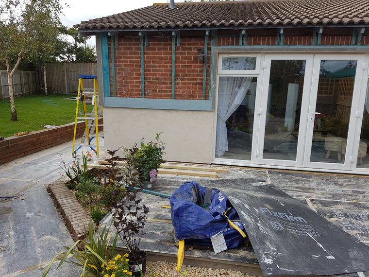 Exterior cladding preparation around patio doors