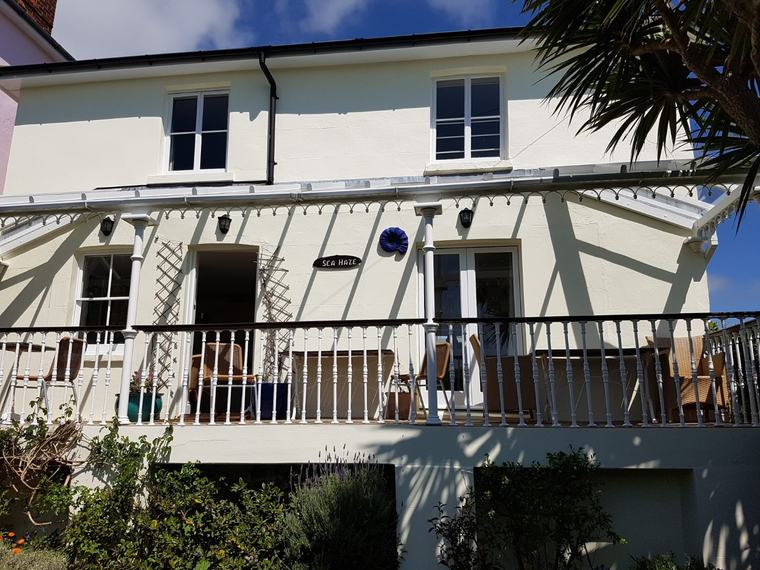 Exterior cladding works in progress around patio doors